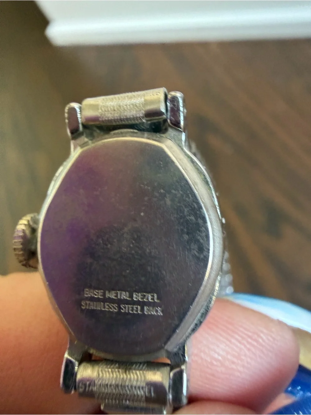 Vintage Timex Watch with an oval silver-tone dial and a flexible expansion band